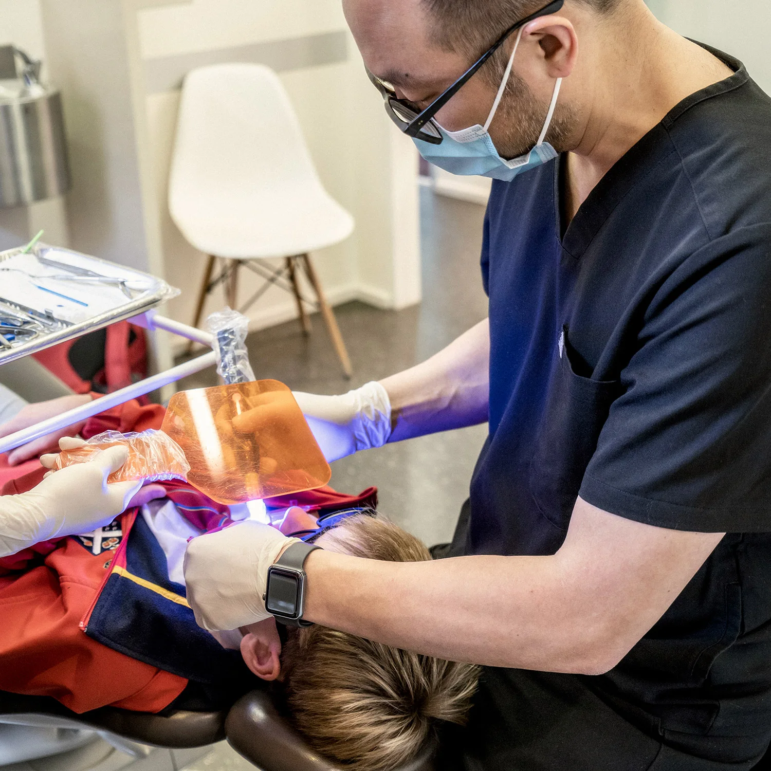 Dr Martin Poon during treatment of patient with orthodontic expander.